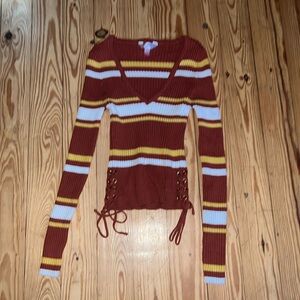 Red orange white and yellow sweater crop top.